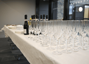 Weddings at The Fraser Centre Table with white table cloth, set with prosecco and champagne glasses